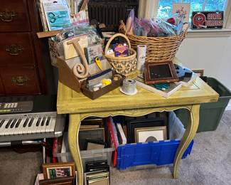 large assortment of picture frames and craft items