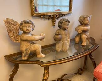 Beautiful wooden cherub figurines, ornate glass top console table 