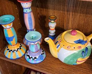 Teapots and candlesticks; flatware in case