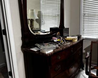 An incredible dresser with a beveled mirror and a marble top in beautiful shape with very nice drawer pulls