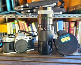 Canon AE-1 camera and lens.