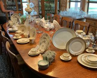 Various China sets one place settings set out for each set