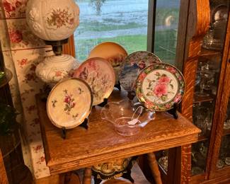 A closer look at the plates with the gone with the wind lamp only Tiger Oak parlor table