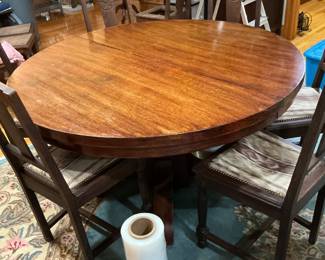  Round dining room table with six chairs measurements 54 inches across. this table has three additional leaves. It is on pre-sale.