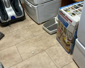 a little floor steamer. Still new in box matching Samsung washer and dryer.