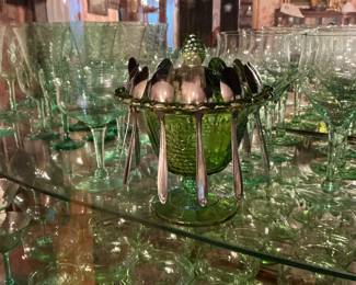 The little sugar bowl with spoons is not uranium. It is carnival glass.