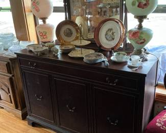 There are several done with the wind lamps 24 karat gold Victorian plates sitting on a 1940s buffet