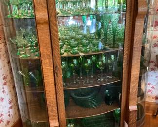 This curio cabinet is reserved for a family member. The green serving pieces are available. this cabinet is full of uranium glass.
