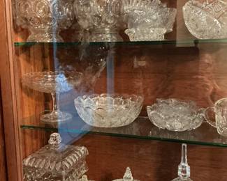 I see covered dishes, wedding cake boxes cut crystal bowls, beautiful collection of genuine  crystals