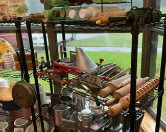 There’s a variety of glass colored, rolling pins, pasta, rollers, old kitchen, gadgets