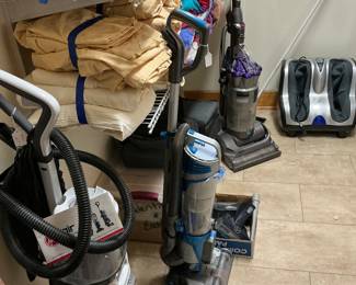 The battery operated Hoover carpet cleaner, Dyson, vacuum cleaner, leg massage machine