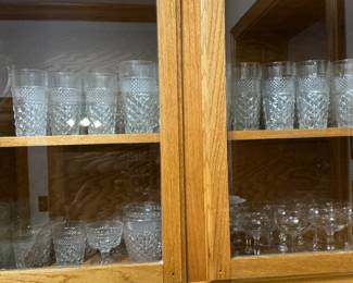 In the bar area, there are various styles of cut glass and crystal
