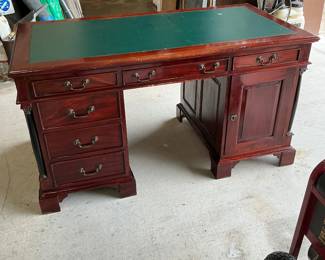 Nice office desk with green leather on top