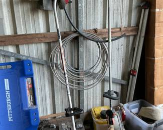 Gas powered weedeater and edger roll around shop dolly