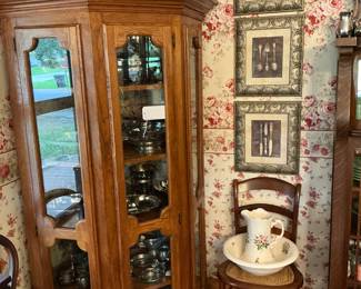 This is a three door curio cabinet fits flush in corner, cane chair.