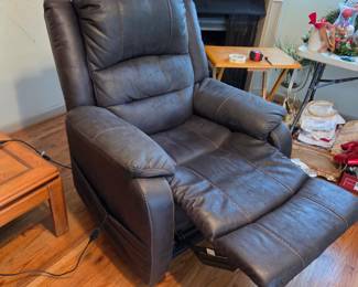 #25	Ashley Furniture Leather Lift Chair electric w/remote (lifts, Foot comes up and Back Reclines)	 $275.00 
