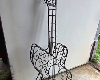 #92	Metal Guitar Wall Hanging - 35" Tall	 $20.00 
