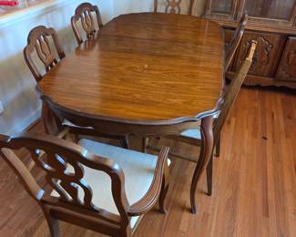#2	Wood Dining Table w/1 leaf & 5 matching chairs ( 6th Chair Slightly Different) 1 chair as is stain on Seat - 60-72x40x31	 $225.00 
