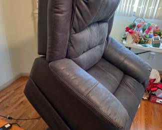 #25	Ashley Furniture Leather Lift Chair electric w/remote (lifts, Foot comes up and Back Reclines)	 $275.00 
