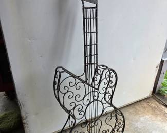 #92	Metal Guitar Wall Hanging - 35" Tall	 $20.00 
