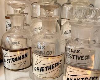 Antique apothecary pharmacy bottles with chemical labels, vintage glass jars for display