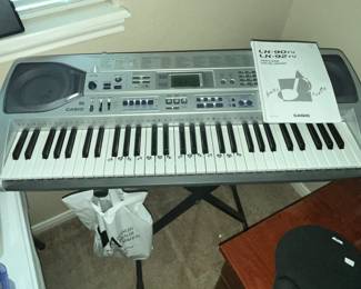 VERY NICE CASIO ELECTRIC KEYBOARD w/ STAND & MANUAL
