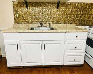 Kitchen countertop, sink, faucet, three cabinet units together with drawers total size 24 depth x 66 length. This is already built and ready for install - perfect for apartment, in-law suite, basement or contractor 