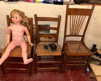 Variety of antique chairs and rockers 
