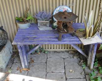 Garden bench for sitting and relaxing, not like the other one that is meant for working