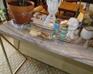 Shells in a bottle, which you could use as a planter too