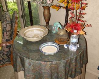 Round table with ample skirting, and lots of fun decorative items
