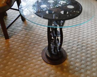 Glass topped table, with a lawnmower plate, flywheel, and solidly put together