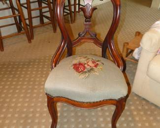 Hand carved wooded chair with needlework seat