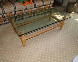 Solid glass topped table, with very ornate base