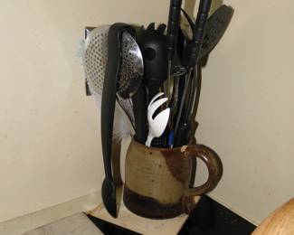 Utensils, in a very unique utensil holder