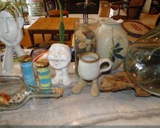 Fun, funky, cool, and smiley planters, and a mug with legs 