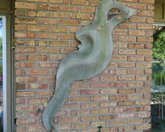 Wall art.  Indoor or outdoor it looks great Seahorse or Mermaid or Merman in shape. Quite lovely. 