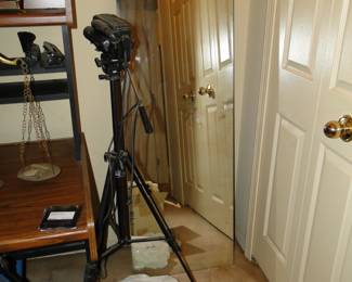 Large mirror, with no frame, and camcorder with tri-pod