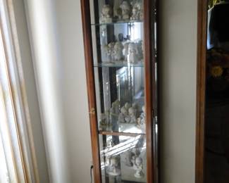 Tall mirror backed display hutch.  Proudly displaying lots of Precious Moments