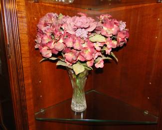 Faux flowers in a real glass vase