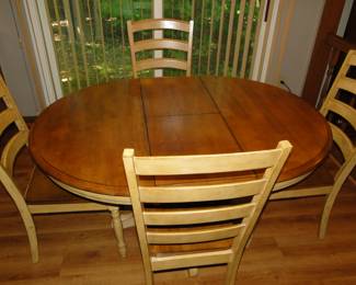 Solid wood table, that can either be round or oval, depending on the number of people that you will be having