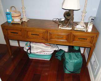 Very versatile, side table, sofa table, entrance table, or if positioned correctly would make a perfect bar