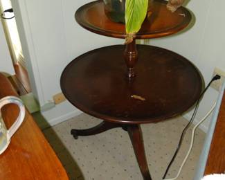 Round two tiered table with live peace lily plant