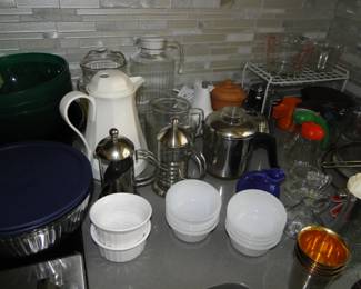 Cups, and bowls and ramekins, and mugs, and pitchers, and tea of coffee pots
