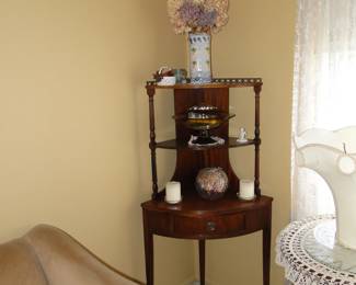 Very unique three tiered corner table.  Or, Thrice in the corner