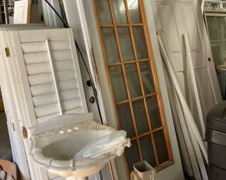 Plantation shutters, Pedestal white sink, doors, Thule roof storage container.