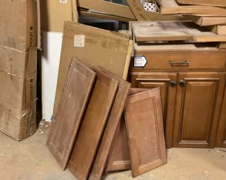 Cabinets and doors. All kinds of wood, metals. Knobs, handles. Beautiful kitchen island. 