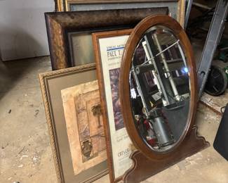 Lots of various pictures and decor. Filing cabinets. Small and large. Bank deposit boxes. 