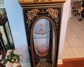 Hand painted curio cabinet with a rare oval cut glass door