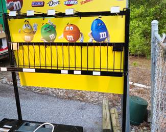 M&M display and a lit of M&M candy dispensers and M&M telephone
